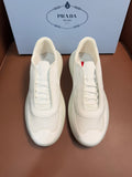 Prada unisex low-top sneakers, light cream leather, lace-up front with stitched panels