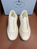 Prada unisex low-top sneakers, light cream leather, lace-up front with stitched panels