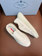 Prada unisex low-top sneakers, light cream leather, side view with lace-up detail