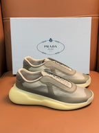 Prada unisex sneakers, cream-beige mesh, gray overlays, laces, chunky yellow sole