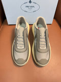 Prada unisex sneakers, cream upper, gray panels, laced front, thick yellow sole