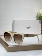Cream sunglasses with square cat-eye frames and dark tinted lenses