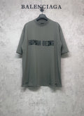 Balenciaga crewneck T-shirt in dark gray-green with “HUMAN BEING” front graphic