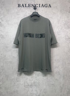 Balenciaga crewneck T-shirt in dark gray-green with “HUMAN BEING” front graphic