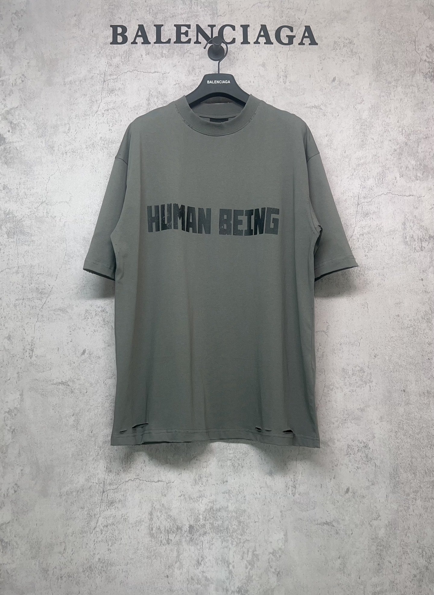 Balenciaga crewneck T-shirt in dark gray-green with “HUMAN BEING” front graphic