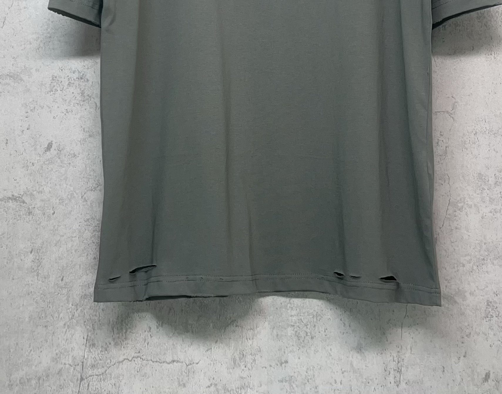 Balenciaga crewneck T-shirt hem detail in dark gray-green, short sleeves