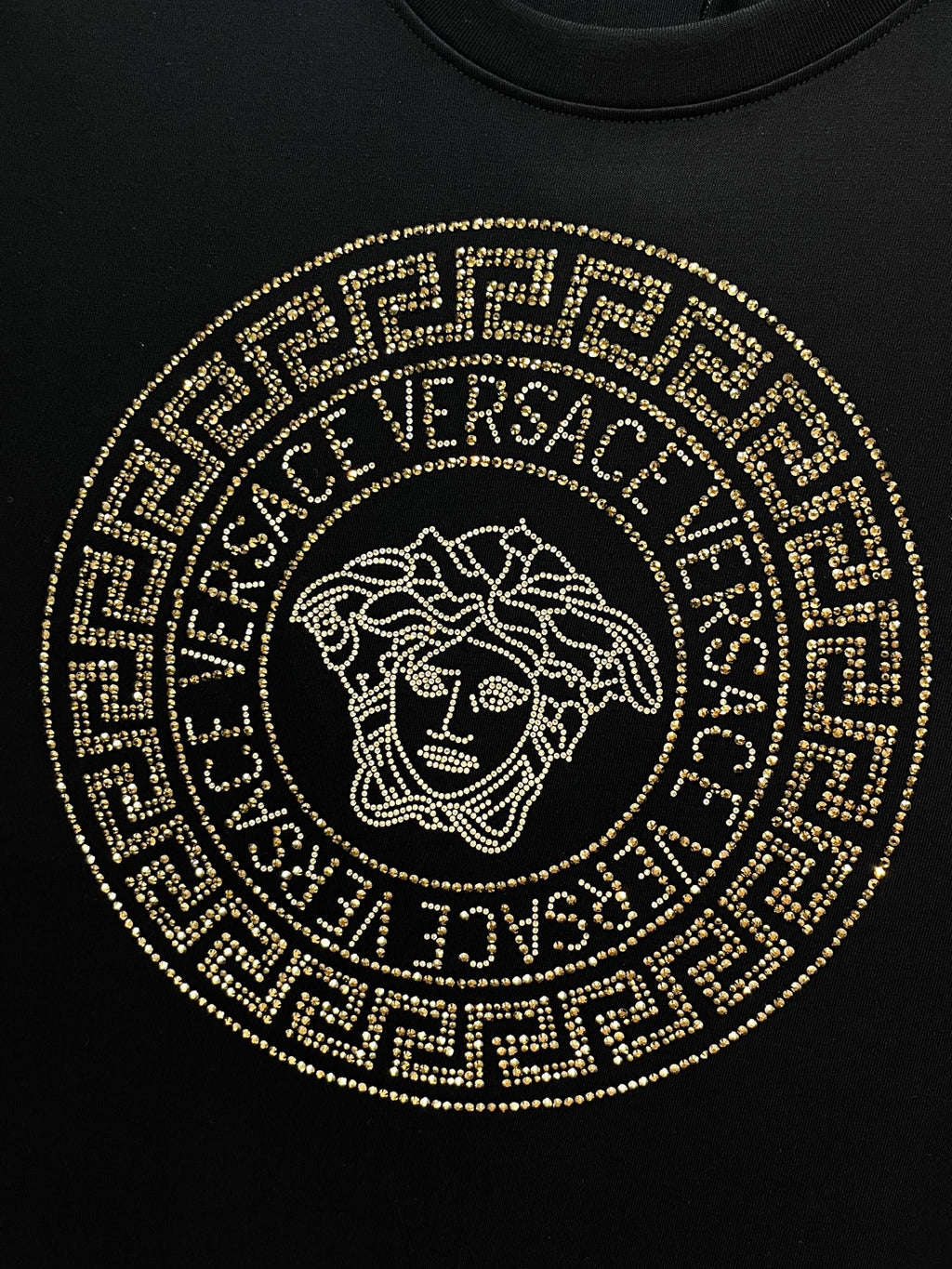 Versace black T-shirt front with gold circular Medusa logo