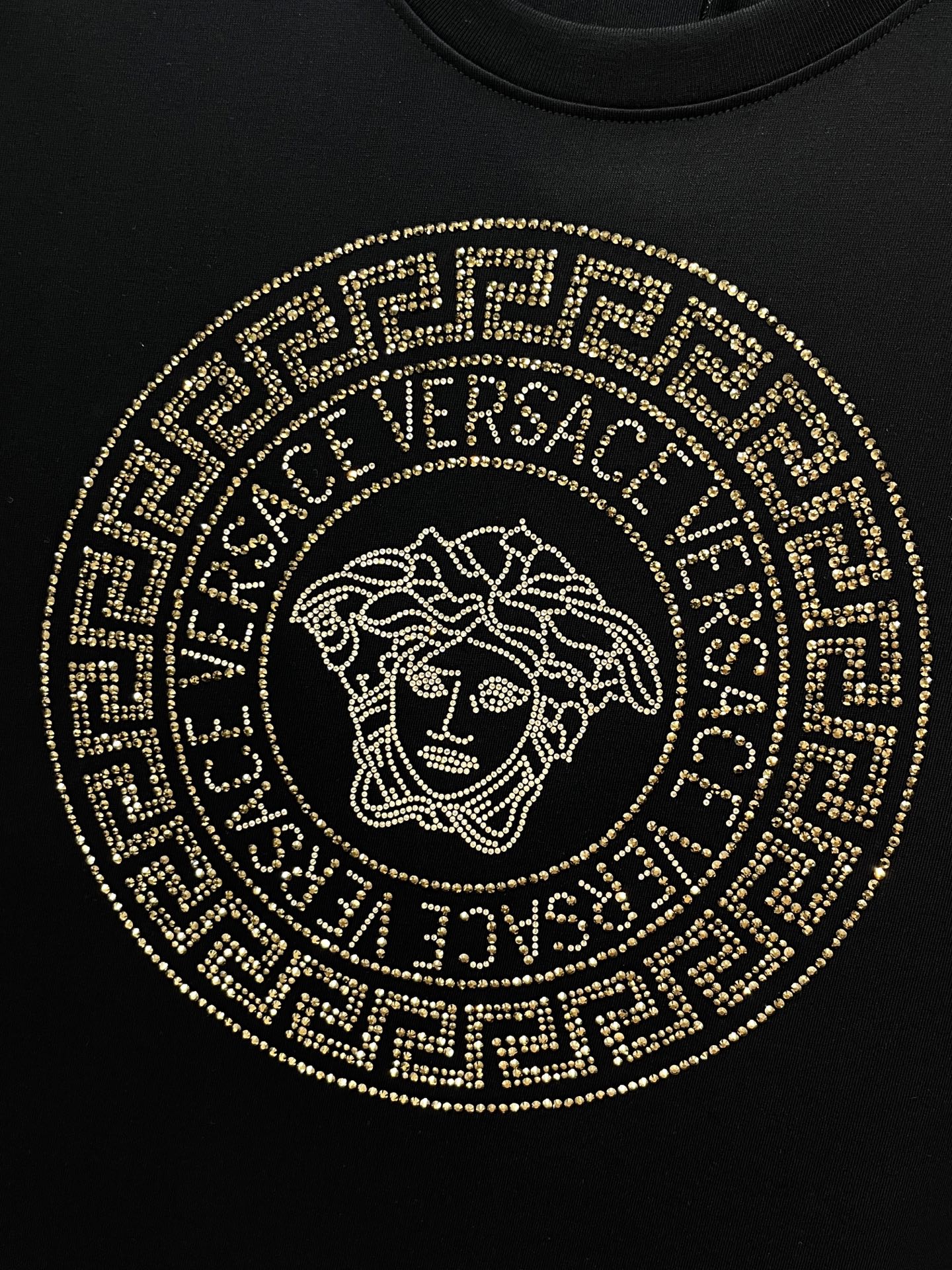 Versace black T-shirt front with gold circular Medusa logo