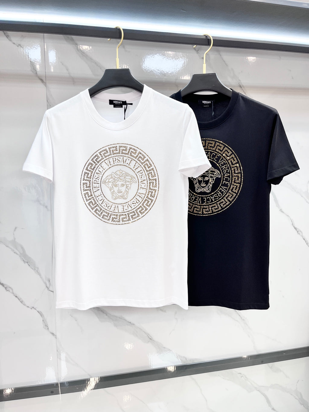 Set of logo T-shirts: white and dark navy, both with Medusa-style emblem on front