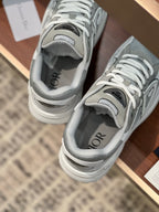 Close-up of light gray sneakers with lace-up tongue and interior lining