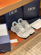Light gray lace-up sneakers with sculpted sides and padded collar