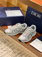 Dior ladies sneakers pair, light gray with lace-up closure and chunky sole
