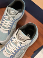 Dior women's sneaker toe and lace area, light blue canvas with white laces