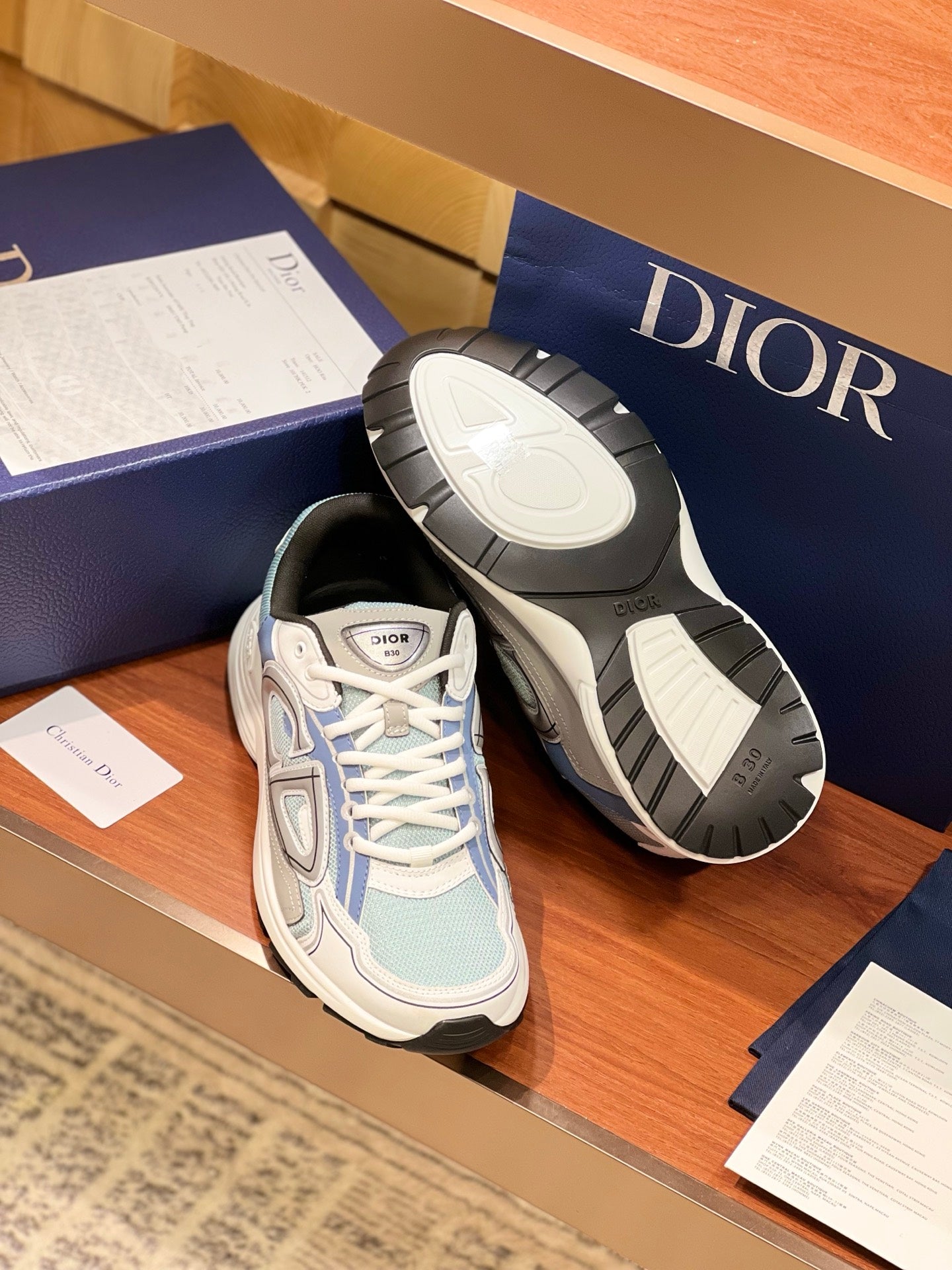 Dior women's sneakers with outsole visible, light blue uppers and textured tread