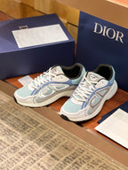 Dior women's lace-up sneakers, light blue uppers with decorative logo overlays
