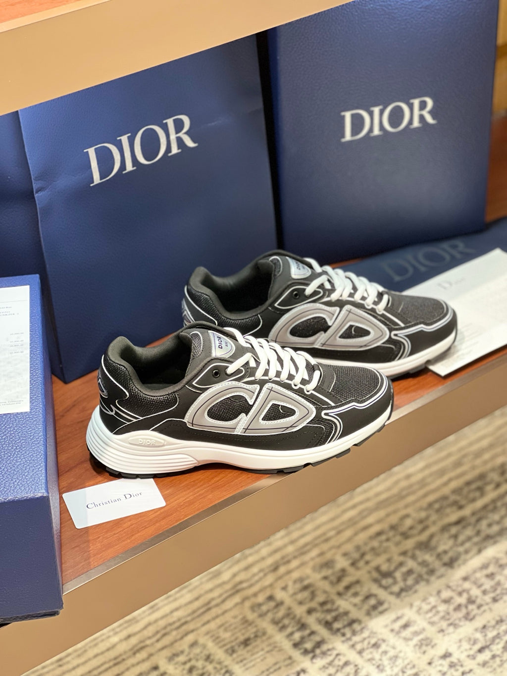 Dior ladies lace-up sneakers, black leather-look with white emblem details
