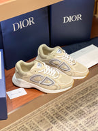 Beige lace-up sneakers with oversized side logo and white midsole stripes