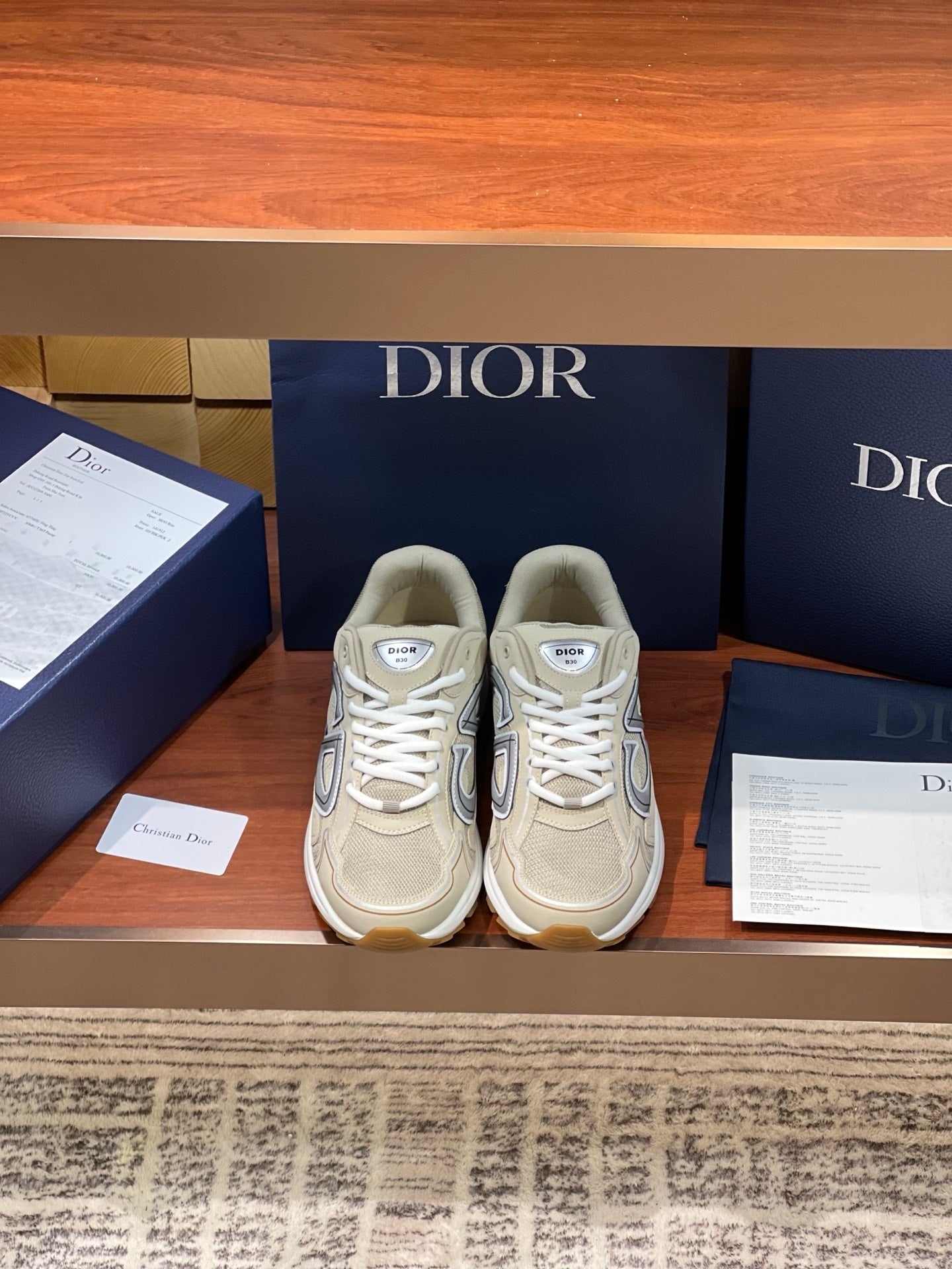 Beige Dior women's lace-up sneakers with metallic logo on side