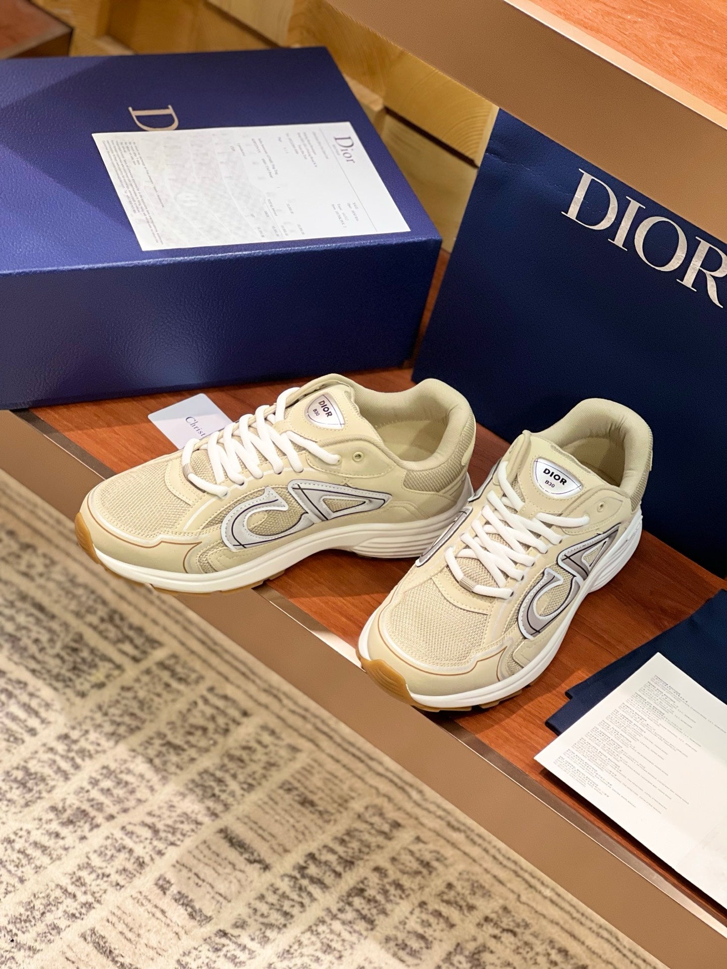 Light beige Dior sneakers, two shoes side by side with lace-up fronts