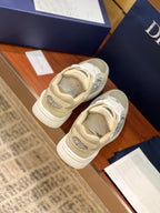 Beige lace-up sneakers from heel view with textured rubber sole