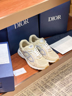 Cream lace-up sneakers with large side logo and cushioned sole