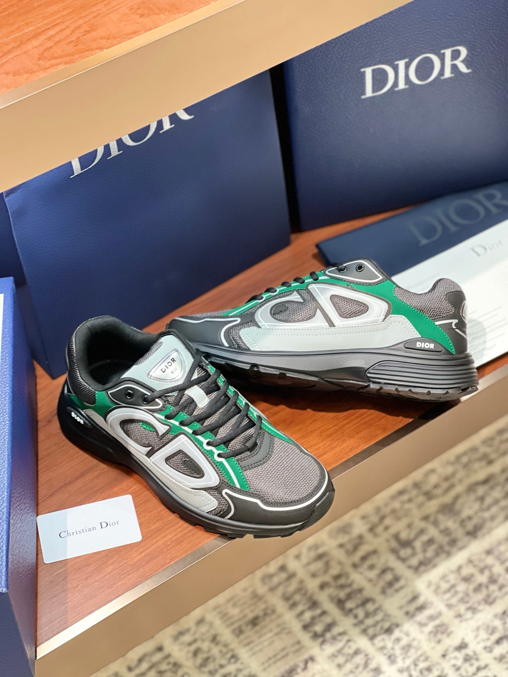 Dior ladies sneakers with white and green accents, grey upper and black sole