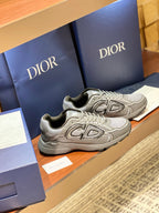 Dior ladies grey lace-up sneakers with cushioned collar and rear panel logos
