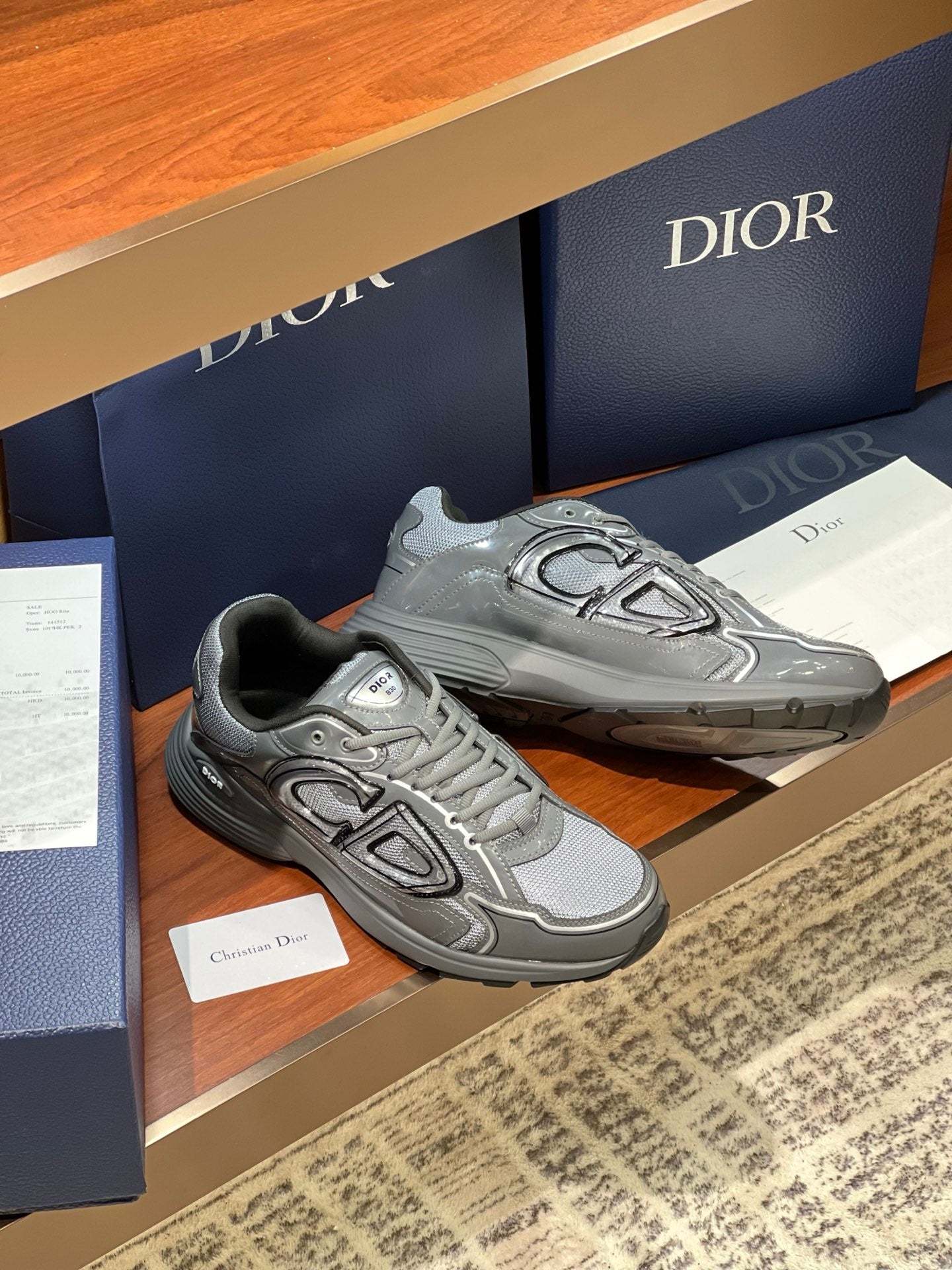 Dior ladies grey lace-up sneakers with embossed emblem on the side
