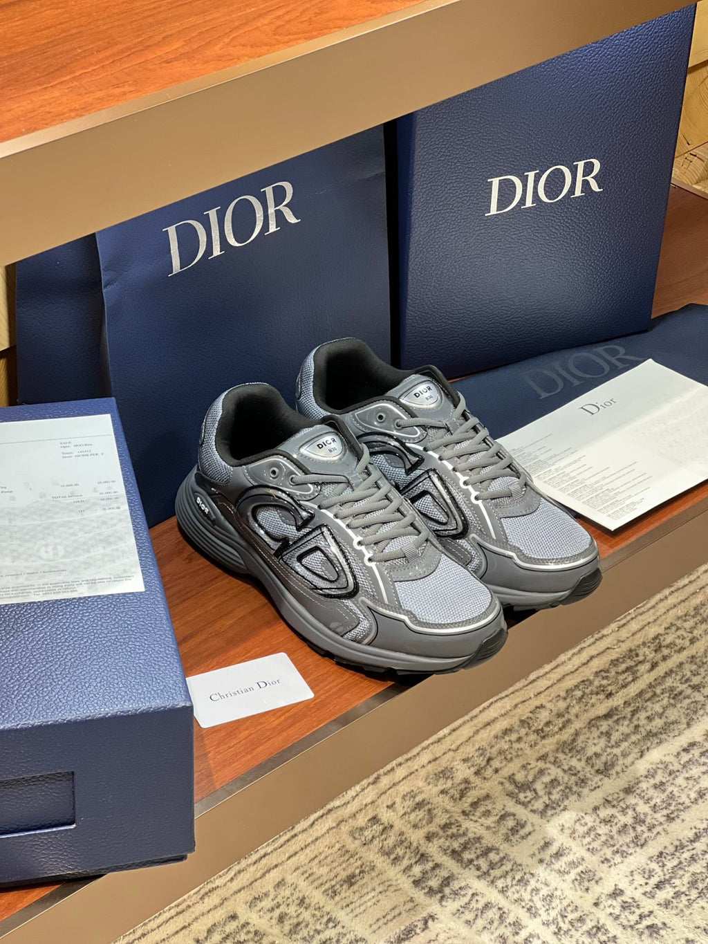 Dior ladies grey lace-up sneakers, side profile with logo detail