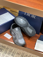Dior ladies grey sneakers with one sole visible, tread and side ridges