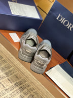 Dior ladies grey sneakers, rear view showing tread and stacked heel