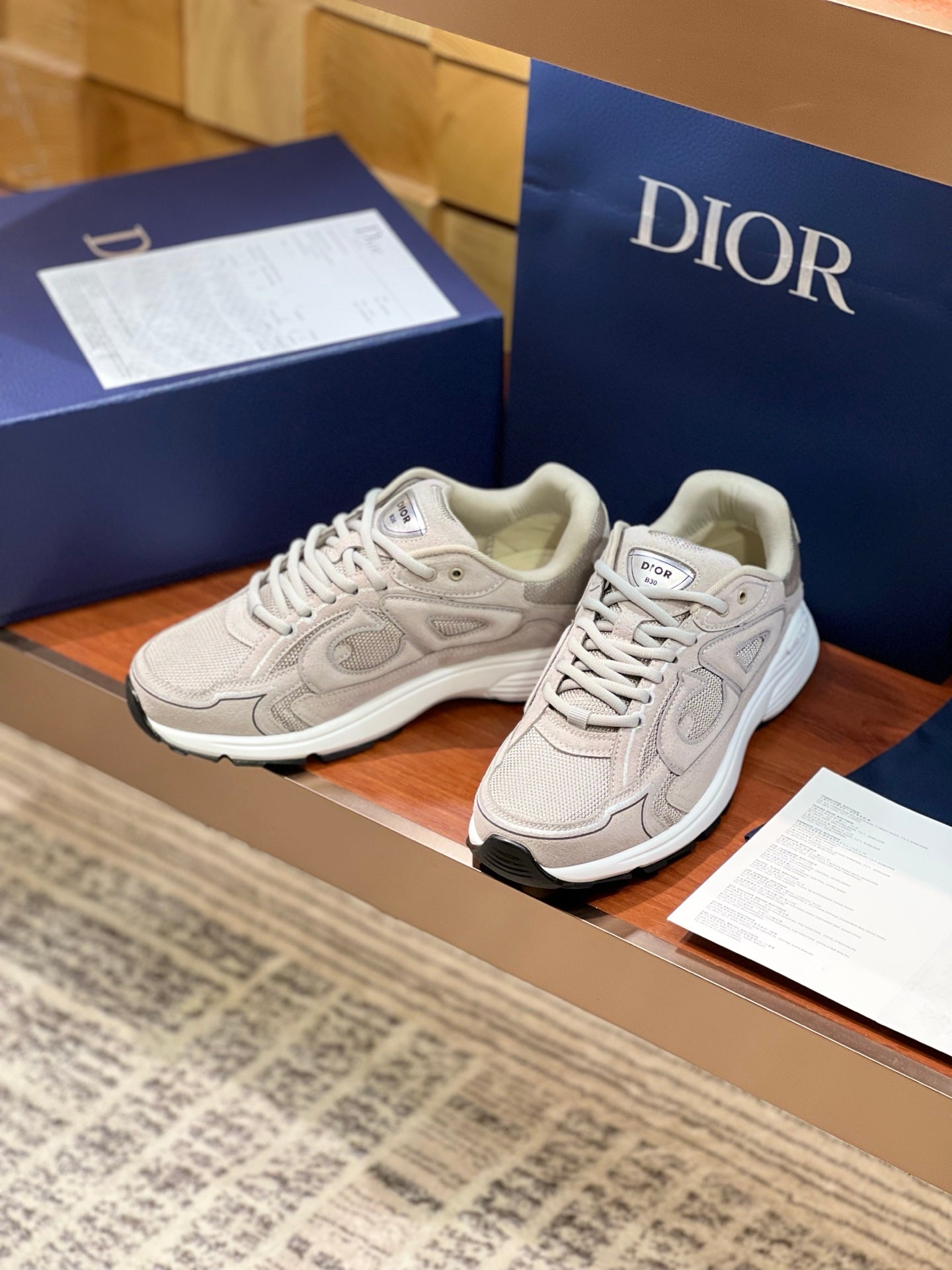 Dior women's beige lace-up sneakers, front quarter view