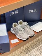 Dior women's beige lace-up sneakers on display, side view