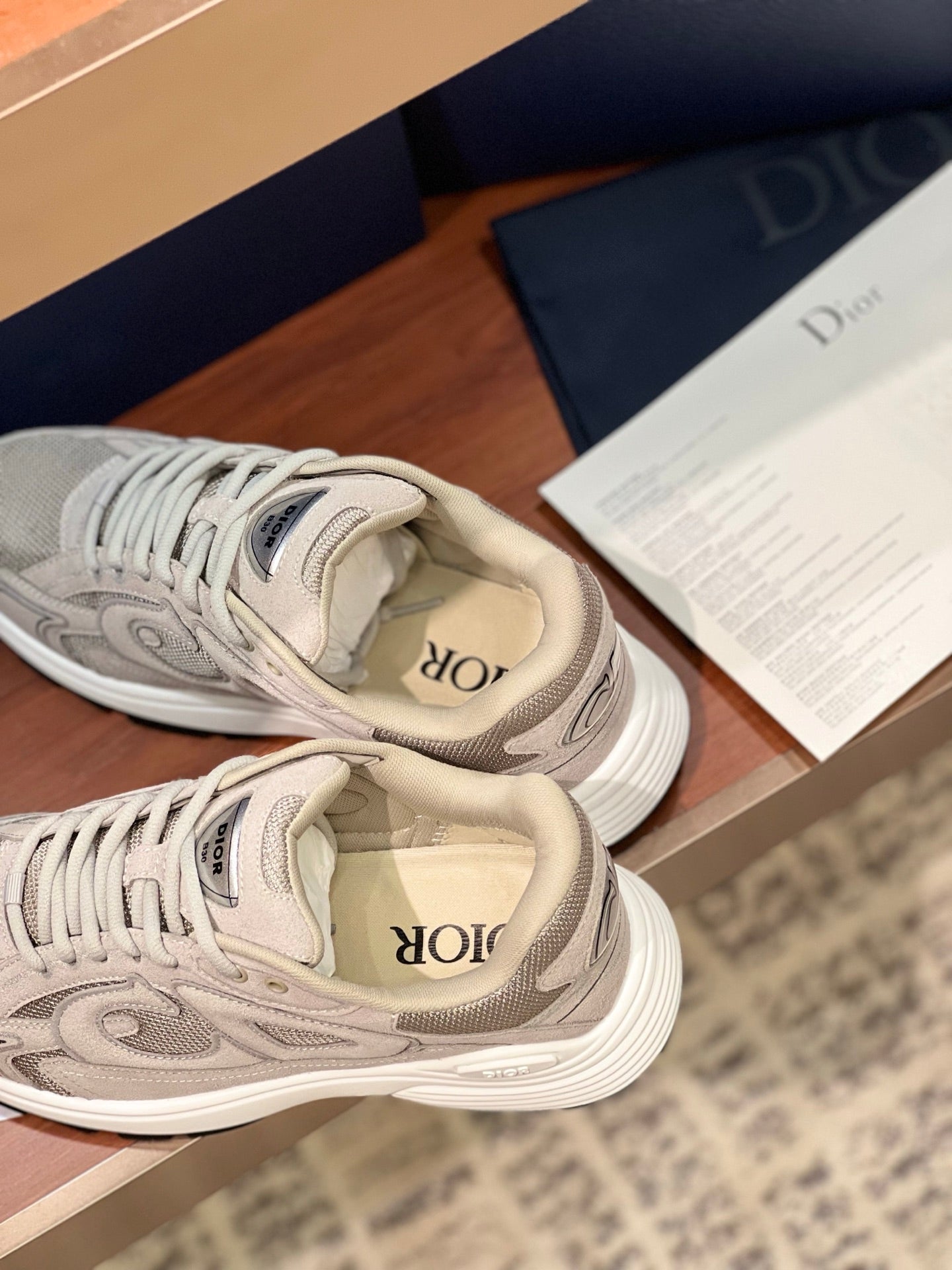 Dior women's beige lace-up sneakers, close-up of laces and side logo