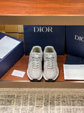 Dior women's beige lace-up sneakers with textured panels and rubber sole