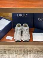 Dior women's beige lace-up sneakers with textured panels and rubber sole