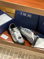 Dior low-top lace-up sneakers, gray and black panels with white laces and logo accents