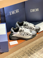 Dior low-top lace-up sneakers, gray uppers with black overlays and white lace-up styling