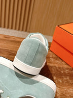 Hermes unisex light blue suede sneakers, rear view with padded collar and white sole