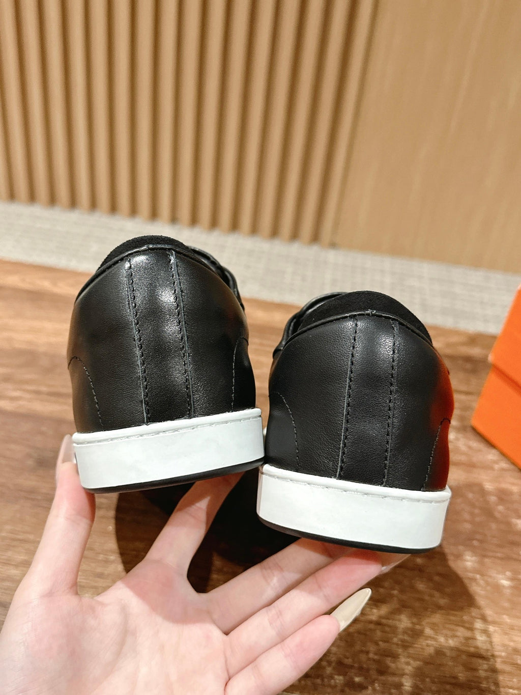 Hermes unisex black leather sneakers with white heel tab and white rubber soles