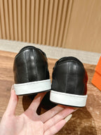Hermes unisex black leather sneakers with white heel tab and white rubber soles