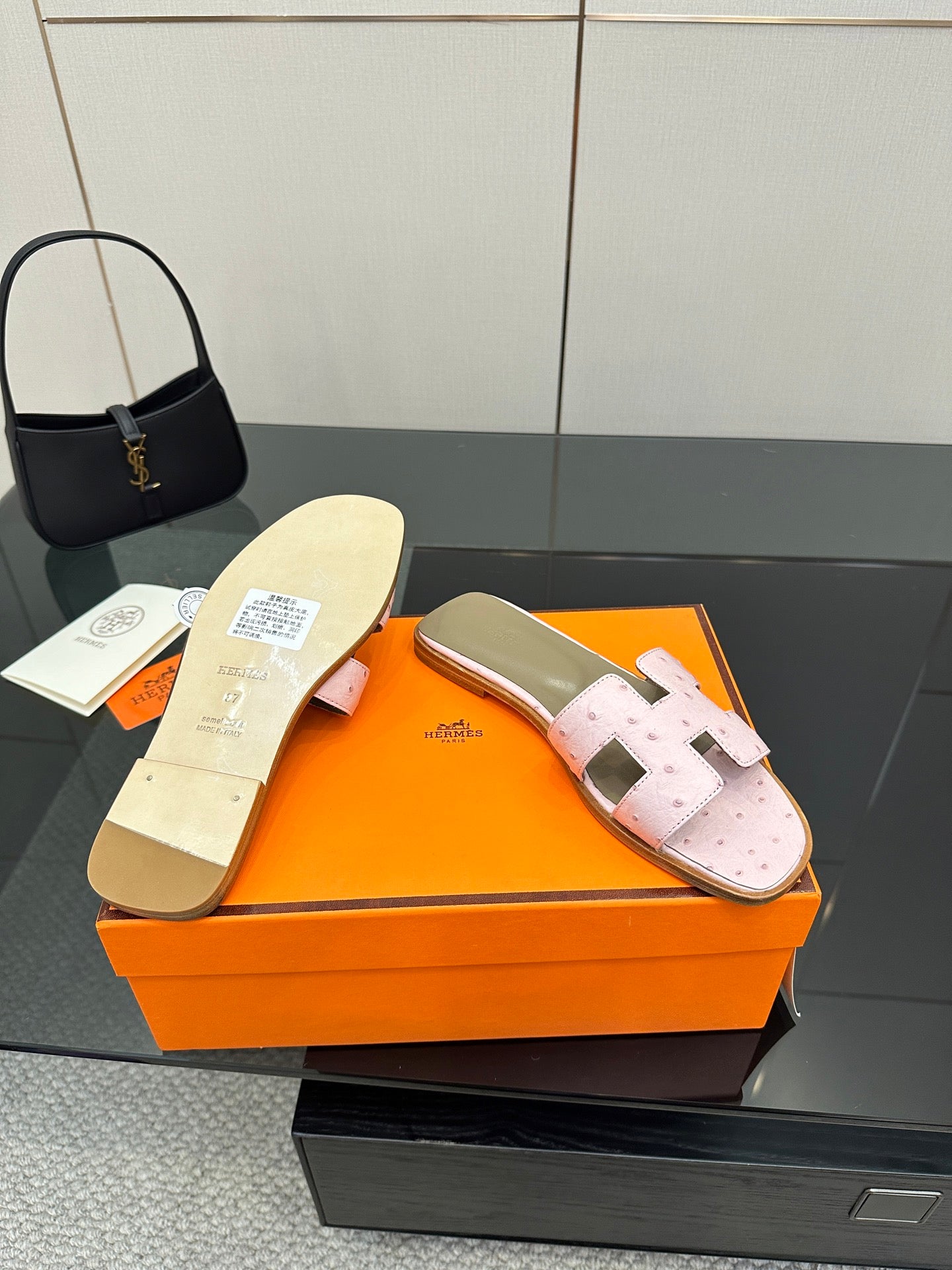 Ladies light pink leather slide sandals with taupe lining and two wide strap closures