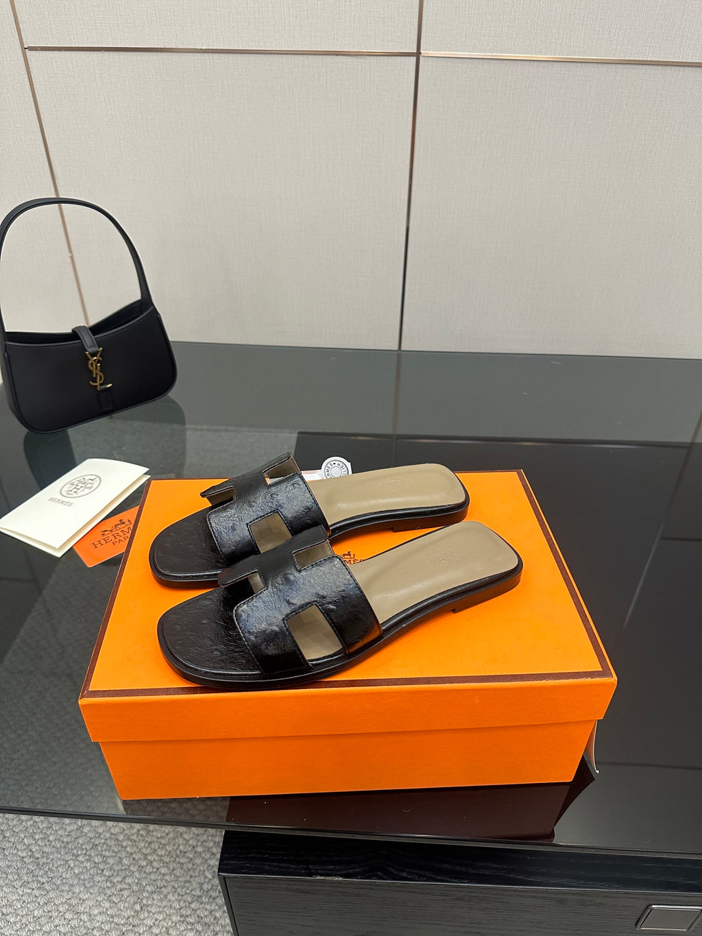 Black leather slide sandals with square toe and wide cross straps