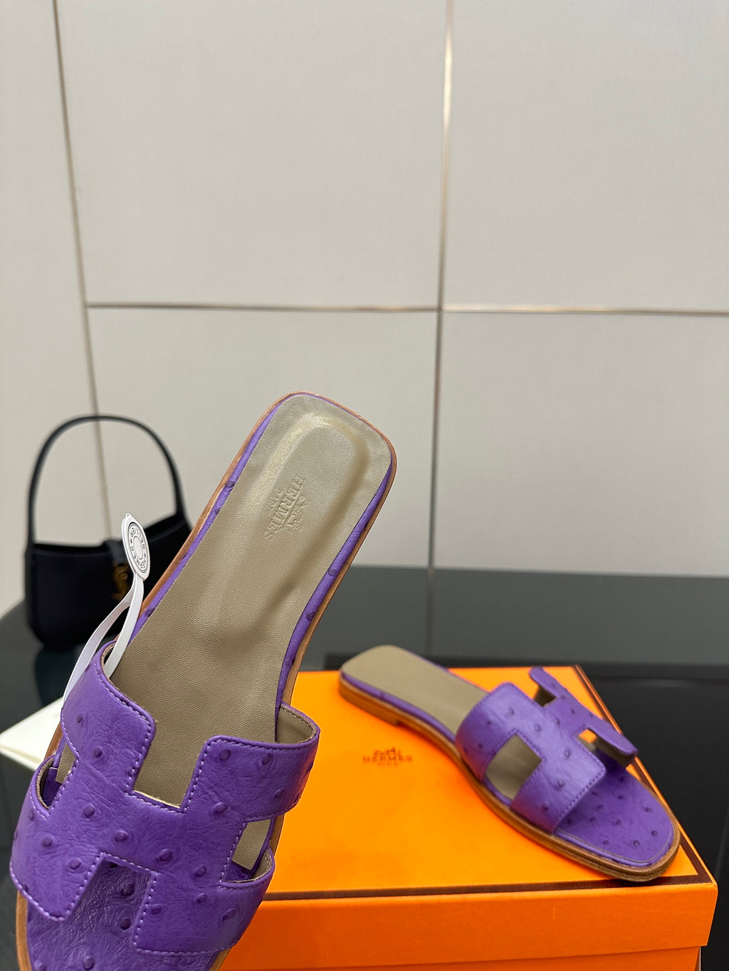 Hermes purple slide sandals, close side view with footbed and cutout strap