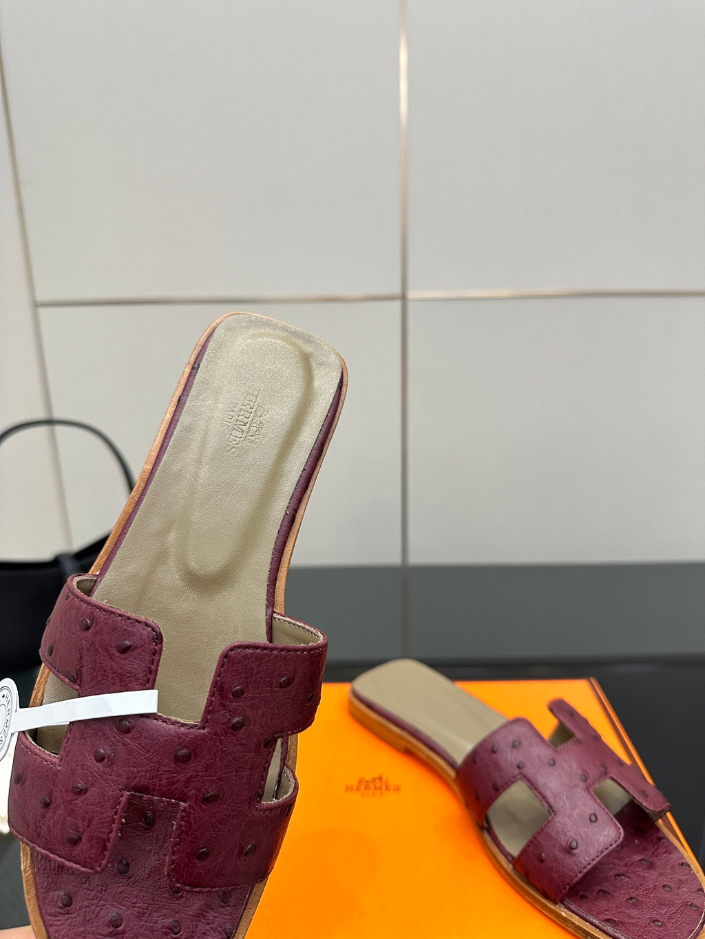 Hermes ladies purple suede slide sandals, close-up of beige insole and strap
