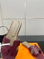 Hermes ladies purple suede slide sandals, close-up of beige insole and strap