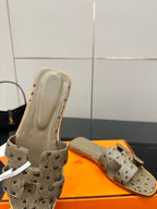 Hermes womens mule sandals in light gray suede with perforated straps and beige lining