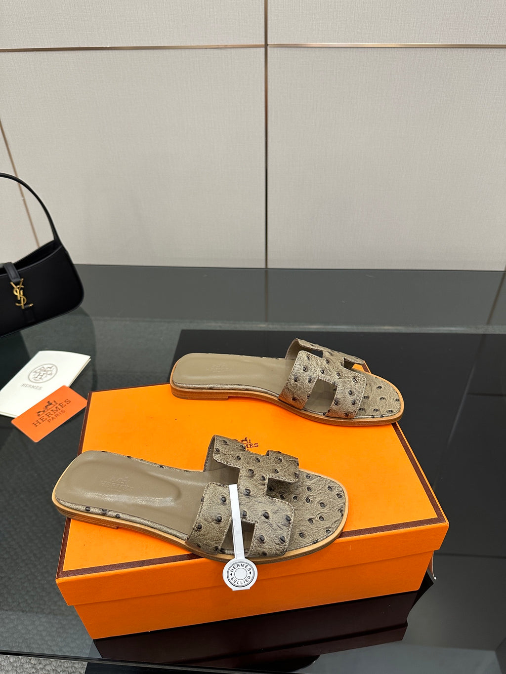 Hermes womens mule sandals in light gray suede with perforated straps and tan footbed