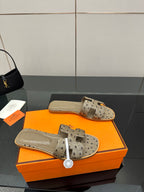 Hermes womens mule sandals in light gray suede with perforated straps and tan footbed