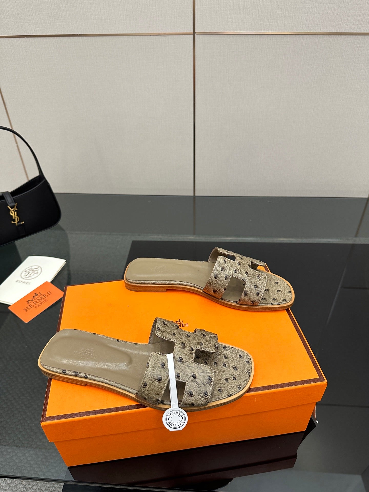 Hermes womens mule sandals in light gray suede with perforated straps and tan footbed